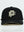 A black baseball cap with a prominent white embroidered geometric logo on the front, photographed against a clean white background.